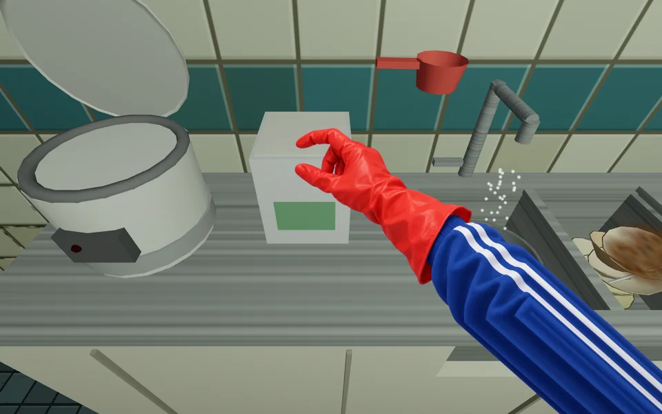 A red rubber-gloved hand scooping rice from a bin into a pot on the shared kitchen counter next to an open rice cooker