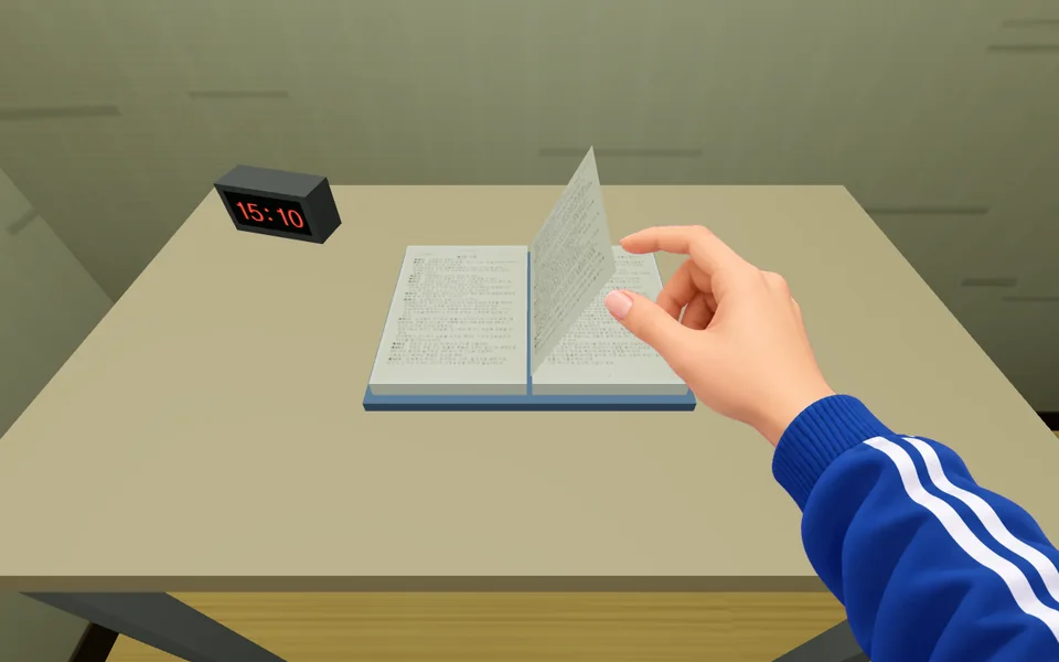 A bare hand turning a page of the constitution book on the desk, with a desk clock showing 15:10