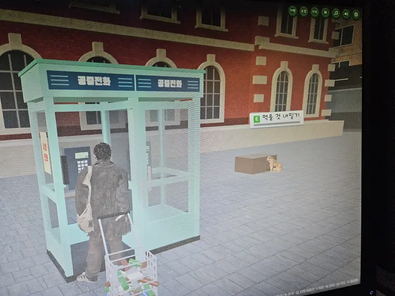 The hero standing at a pay phone booth with the dog sitting behind him and the hold out food prompt on screen